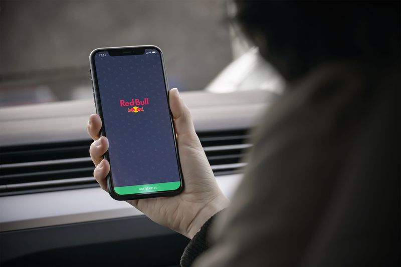 Red Bull app on iPhone in a distribution van